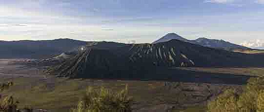 Valley with trees and mountains.