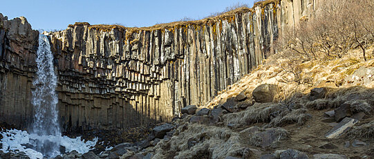 Waterfall on brittle rock formation.